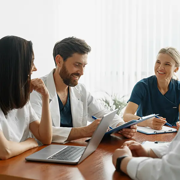 A group of doctors and nurses in a meeting